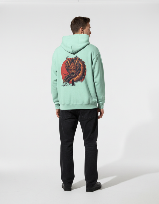 Man wearing mint green hoodie with dragon back print
